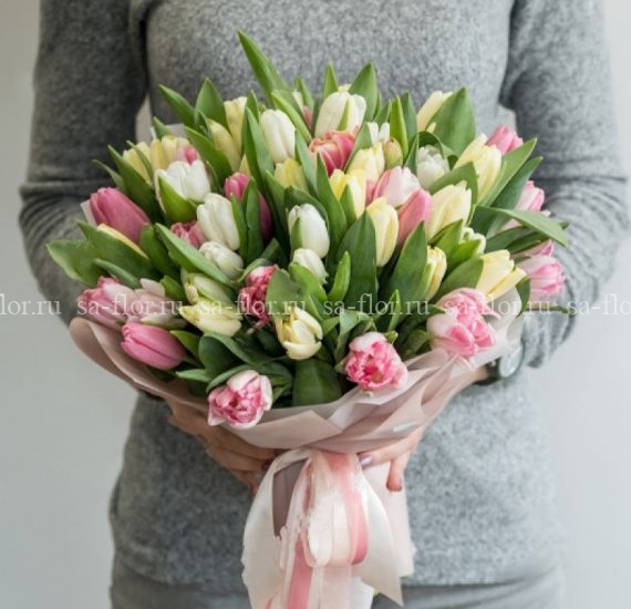 stock-photo-female-holding-beautiful-bouquet-of-colored-spring-tulips-flowers-copy-text-card-background-1061184494-2